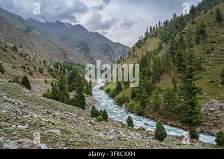 Rural mountain landscape view of picturesque Astore river valley under moody sky, Gilgit Baltistan, Pakistan Stock Photo