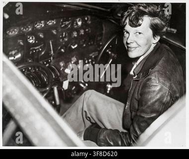 Amelia Earhart (1897- circa 2nd July 1937), American aviation pioneer in the cockpit of an Electra airplane, 20th Century photograph, by Acme Newspictures (New York), 1937 Stock Photo