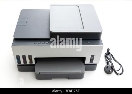 A modern multifunction printer stands on a white background Stock Photo