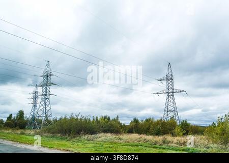 Ryazan, Russia, 28.09.2025 Power line towers with high voltage cables extending across a cloudy sky, illustrating electricity transmission and infrast Stock Photo