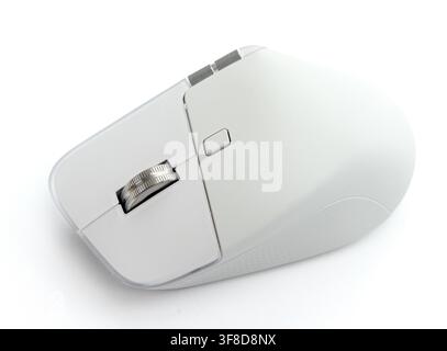 A modern white wireless computer mouse rests on a white background Stock Photo