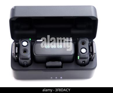 Wireless microphone charging case with two transmitters inside Stock Photo