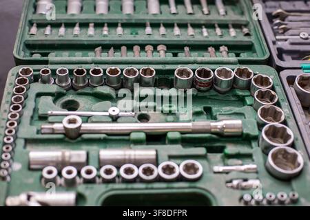 Moscow, Russia, 10.04.2020 Close up of a green mechanic tool box filled with various socket wrenches and bits for car repair. Auto service equipment f Stock Photo