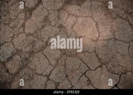 Cracked earth texture showing dry soil from extreme drought. Stock Photo