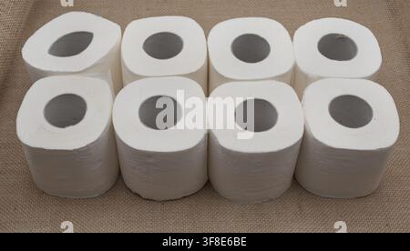 Multiple toilet paper rolls stacked in rows representing essential household supplies, personal hygiene products and everyday necessities Stock Photo