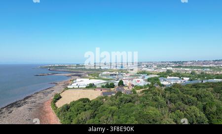 Aerial Drone View Of Rocky Foreshore And Coastal Fields Near Moelfre aerial-drone-view-of-rocky-foreshore-and-coastal-fields-near-moelfre