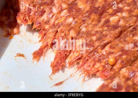 Close-up of raw Romanian mici, traditional skinless minced meat rolls prepared for grilling, seasoned with garlic and spices, ready for the barbecue i Stock Photo