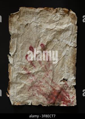 Aged Paper with Red Handprint — Historical Texture and Mystery on Black Background Stock Photo