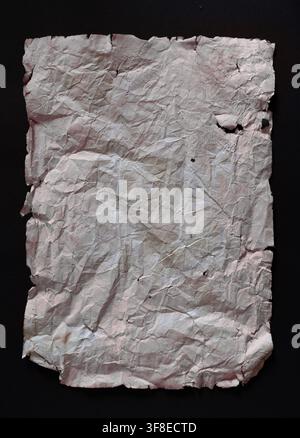 Wrinkled Vintage Paper with Torn Edges on Black Background — Texture and History Concept Stock Photo