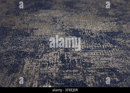 Detailed close up of an abstract woven tapestry fabric background with shallow depth of field Stock Photo
