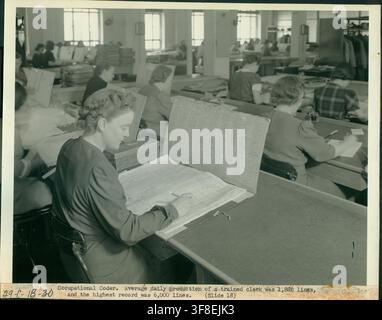 An occupational coder at work, with a trained clerk's average daily production of 1,886 lines and a highest record of 6,000 lines, during the Sixteenth Decennial Census, as documented by the Records of the Bureau of the Census. Stock Photo