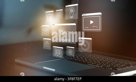 E learning concept with digital tools on a laptop in a home office setting Stock Photo