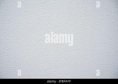 White textured concrete wall background with rough plastered stucco surface finish Stock Photo