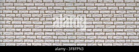 Wall made of light-colored, rectangular stones and brown gaps Stock Photo