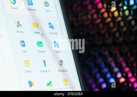 New York, USA - august 10, 2026: Click on google meet app on computer screen close up view Stock Photo