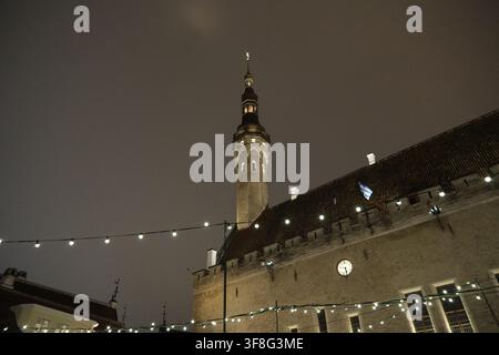 Tallinn, Estonia-Nov.29th 2025: Night view of Tallinn Town Hall, historic tower illuminated against the dark sky, low angle view Stock Photo