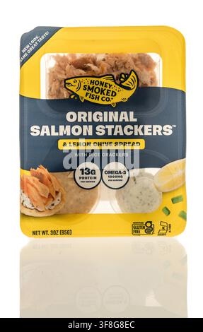 Winneconne, WI - 23 June 2026: A package of Honey Smokes fish original salmon stackers lemon chive spread crackers snack on an isolated background. Stock Photo