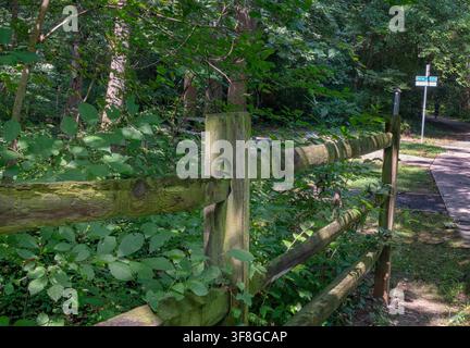A rustic, weathered wooden split-rail fence Stock Photo