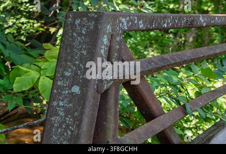 A close-up of a weathered, rusted metal truss structure Stock Photo