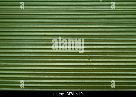 Green corrugated plastic texture full frame background close up. Stock Photo