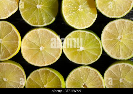 sliced lime on black background top view Stock Photo