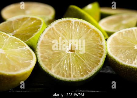 sliced lime on black background Stock Photo