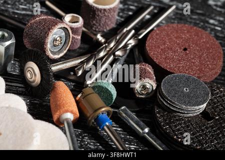 multitool bits set on black wood background Stock Photo