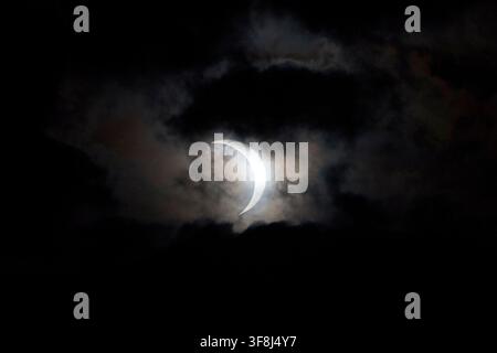 partial solar eclipse as seen through the cloud over belfast lough, 12th august 2026 Stock Photo