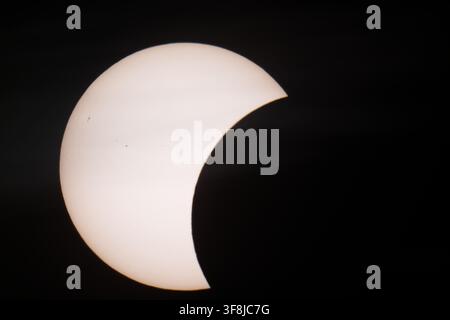 During a solar eclipse, the Moon passes in front of the Sun. Stock Photo