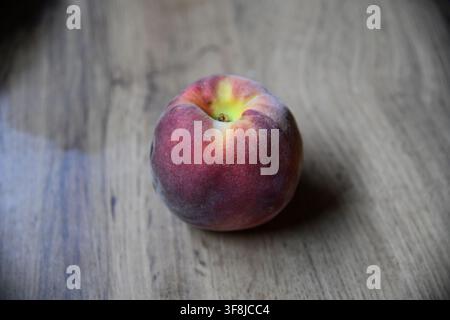 Ripe juicy peach with fuzzy skin and vibrant orange-red hues, isolated on transparent background for healthy food advertising and recipes Stock Photo