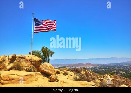 American Flag Waving on Mt Rubidoux Overlooking San Bernardino California Landscape Stock Photo