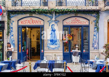 Sidewalk view of facade of Leitaria A Camponeza Restaurant with blue and white decorative tiles, Lisbon, Portugal Stock Photo