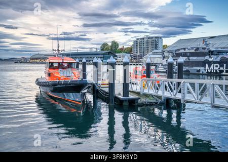 Pilot boats docked in the late afternoon on the waterfront of Hobart in Tasmania, Australia. Stock Photo