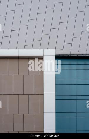 Abstract architectural panels forming a geometric background in grey, brown, white, and teal blue colors. Stock Photo