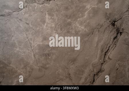 Dark gray marble stone texture with natural white and black veining patterns. Stock Photo