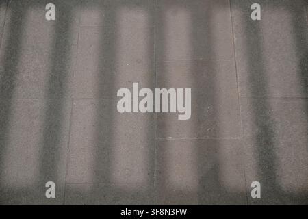 Shadow patterns on concrete pavement or wall tiles. Stock Photo