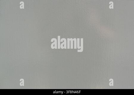 Light grey painted flat metal surface texture background. Stock Photo