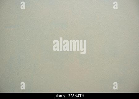 Light gray painted wall texture background with subtle stippled surface details. Stock Photo