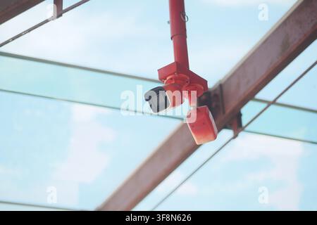 Security camera is mounted on the roof of a building Stock Photo