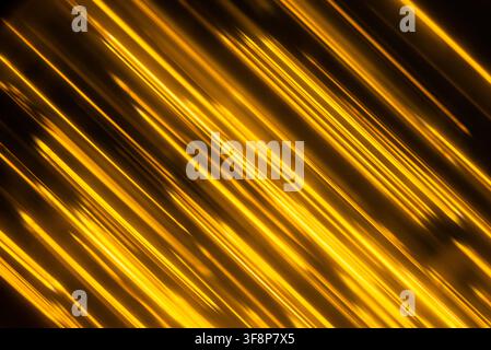 Luxurious golden metallic lines moving in a rhythmic swinging motion with soft light reflections Stock Photo