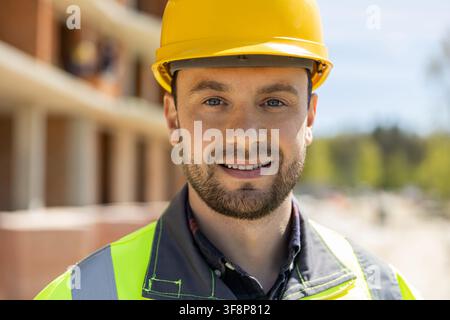 Young male engineer wearing yellow safety helmet Stock Photo