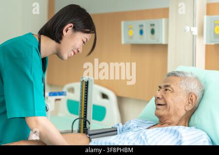 doctors or nurses checking symptoms senior man in the hospital. senior male happy after receiving treatment from a professional doctor. health care, p Stock Photo