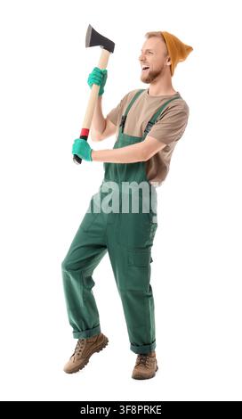 Happy young lumberjack in green overalls and beanie holding an axe, isolated on a clean white background Stock Photo