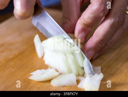 Finely chopped onion on a cutting board, close-up Stock Photo