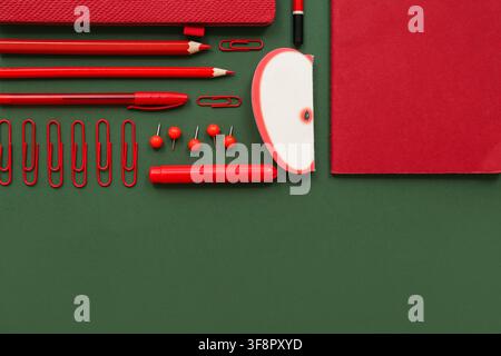 Composition with different stationery on green background Stock Photo