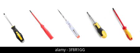 Five different types of screwdrivers with various handles and tips, essential tools for repair and construction, isolated on a white background Stock Photo