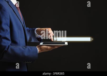 Businessman using a smartphone with a glowing search bar and magnifying glass icon, digital information access and online browsing Stock Photo