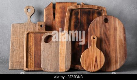 Assortment of wooden cutting boards and serving boards for kitchen and culinary use, rustic kitchenware, a collection of various wooden cutting boards Stock Photo