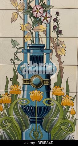 Maiolica tiles depict a vibrant floral vase design in a classic art style. Intricate patterns of blooming flowers and ornate vase elements, showcasing Stock Photo