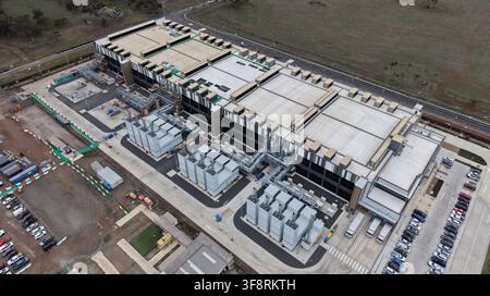 Large modern data center building with surrounding infrastructure providing digital information storage and networking solutions Stock Photo